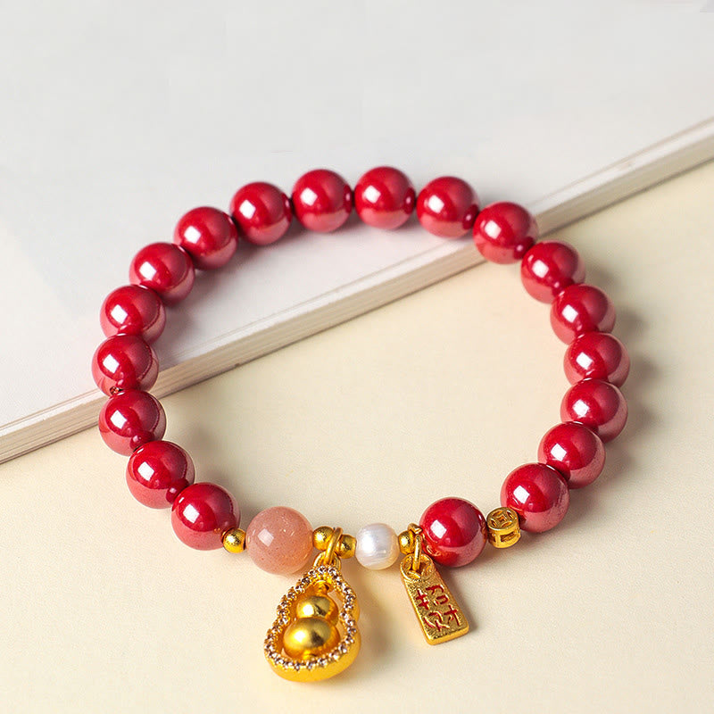 Armband Zinnober – Segen & Glück mit goldenem Kürbis Anhänger und Perle