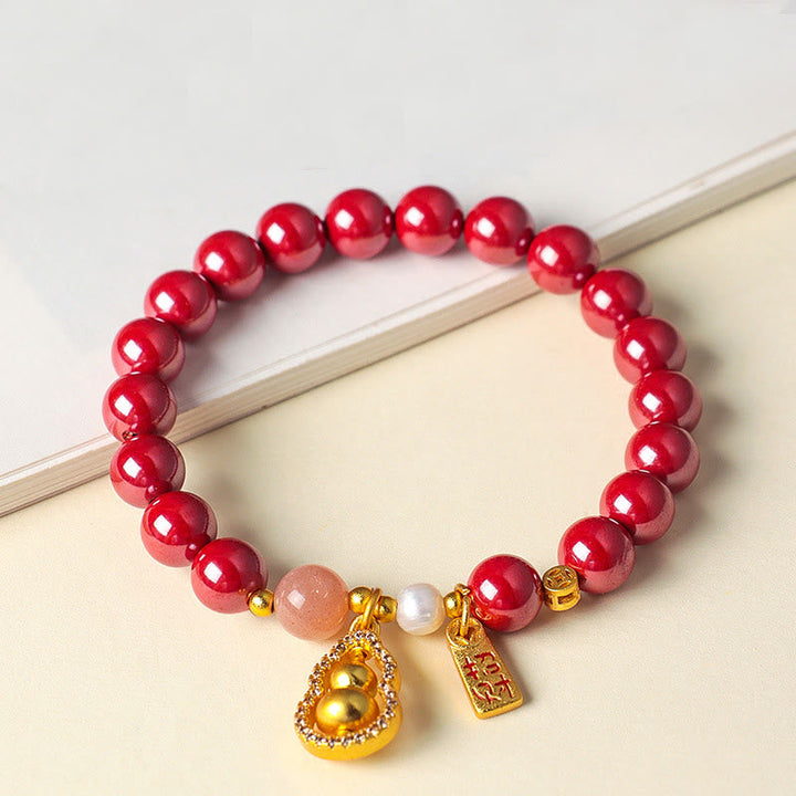 Armband Zinnober – Segen & Glück mit goldenem Kürbis Anhänger und Perle