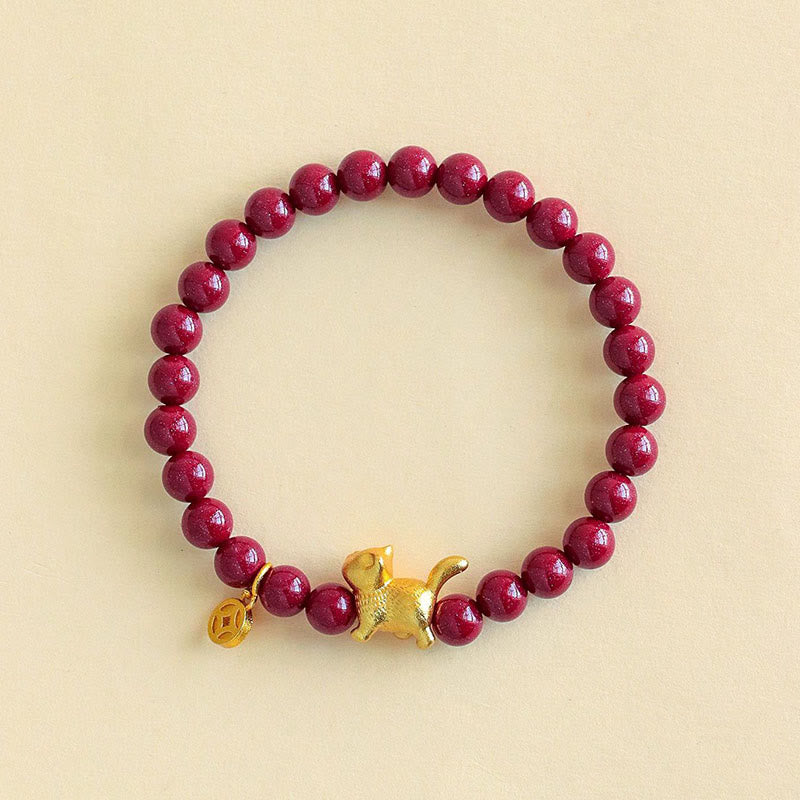 Armband Zinnober Granat Katze Schutz Glück goldene Katze Münze Handgelenk