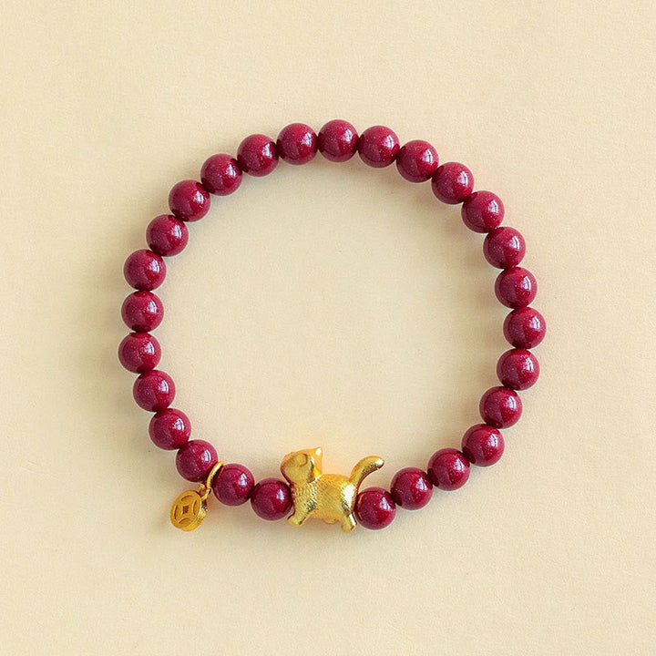 Armband Zinnober Granat Katze Schutz Glück goldene Katze Münze Handgelenk