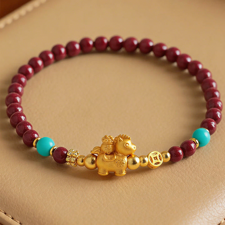 Armband Zinnober Fu-Zeichen Ruhe Energie goldenes Pferd türkis Perlen