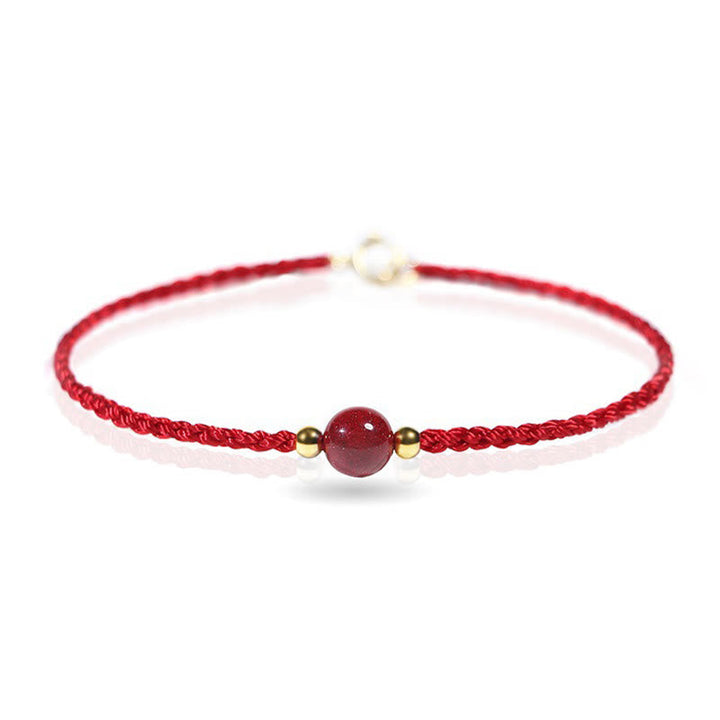 Armband Zinnober Rotes Band geflochten mit Perle Schutz Glück Handgelenk