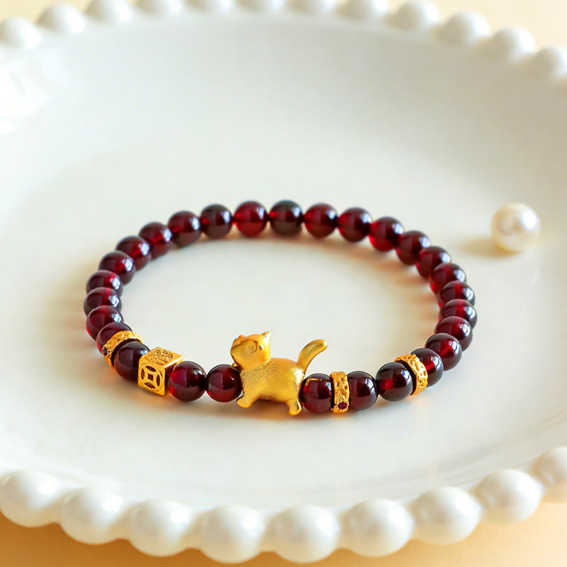 Armband Zinnober Granat Katze Schutz Glück goldene Glückskatze Perlen Schale