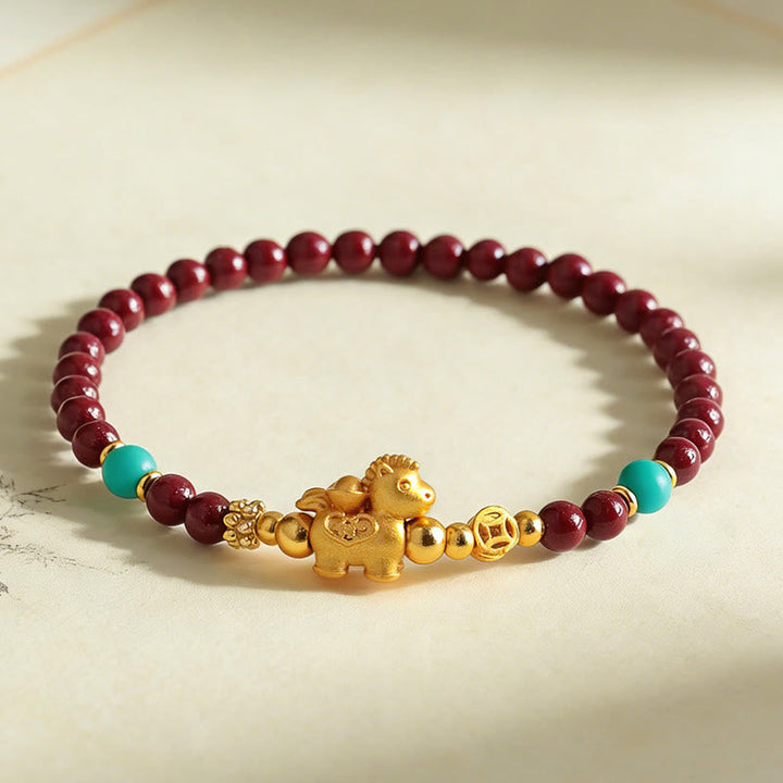 Armband Zinnober Fu-Zeichen Ruhe Energie goldenes Pferd türkis Perlen Handgelenk